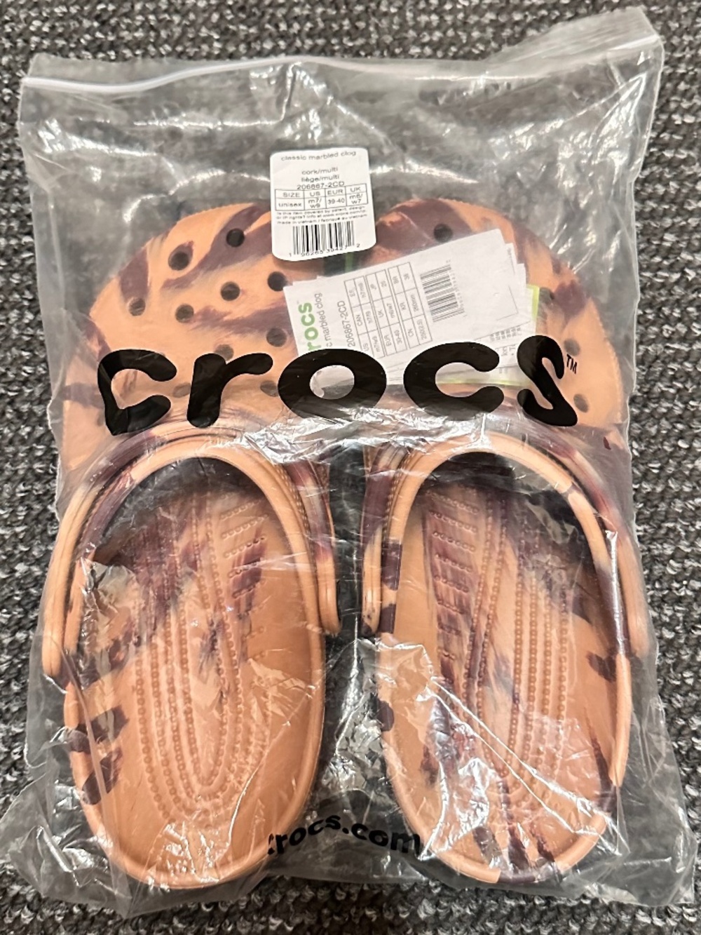 Crocs Classic Marbled Clogs brown and white marbled pattern